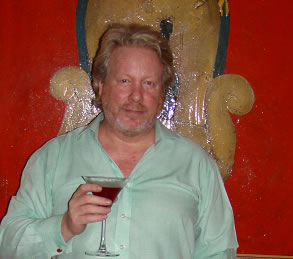 The author, after taking these photos, clutching a Pomegranate Martini. Cocktails in India should be a combination of cold, fruity, strong, exotic and reviving. 
